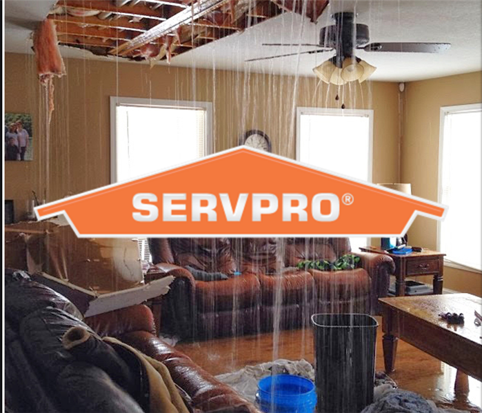 SERVPRO logo with water damage coming down from ceiling 